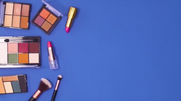 Eye Shadow Palettes Brushes Lipsticks Appear Left Side Dark Blue — Stock Video