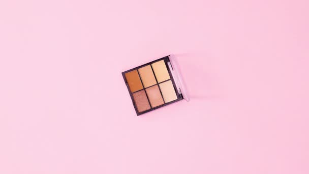 Eye Shadow Palette Rotating Pastel Pink Background Stop Motion Flat — Stock Video
