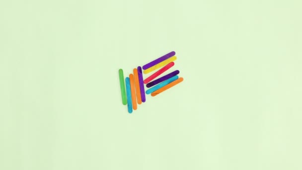 Wooden Colorful Sticks Appear Making Hello Word Pastel Green Background — Stock Video