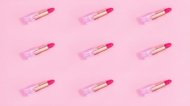ピンクのテーマにピンクの口紅を動かすパターンを作る創造的な 動くな — ストック動画