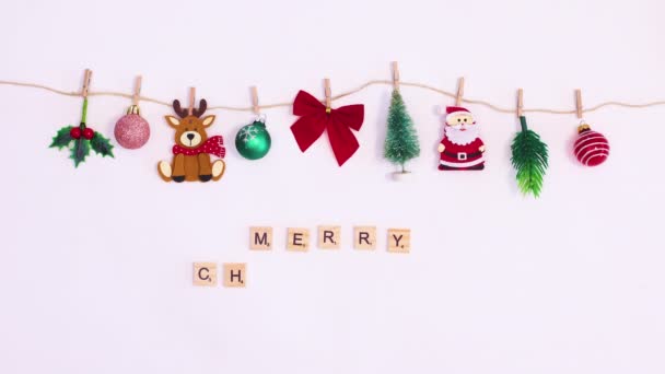 Merry Christmas Text Wooden Cubes Appear Rope Hanged Christmas Decorations — Stock Video