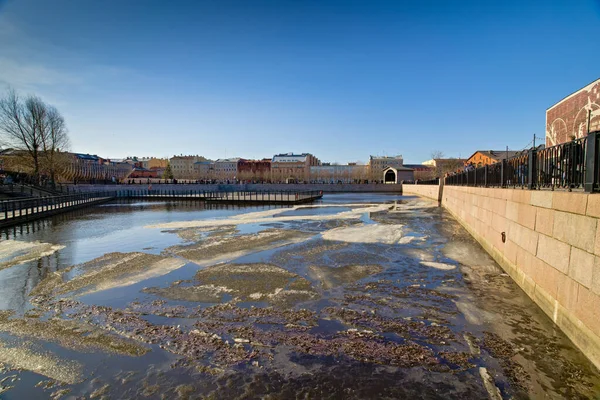 city park with ice pool in spring on a sunny day. novaya gollandiya. st petersburg russia