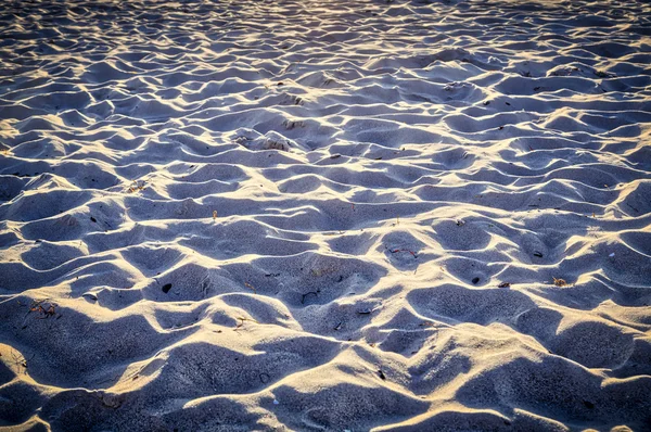 Närbild av sand på en strand för bakgrunder — Stockfoto