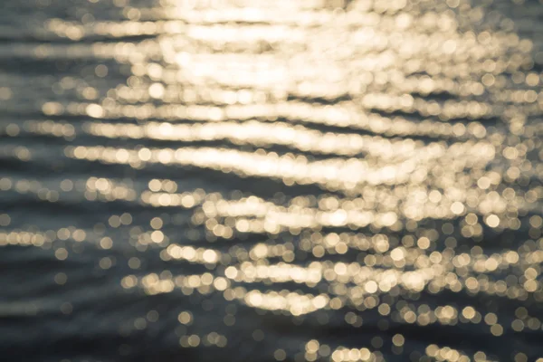 Blurred ocean background with reflections and bokeh — Stock Photo, Image