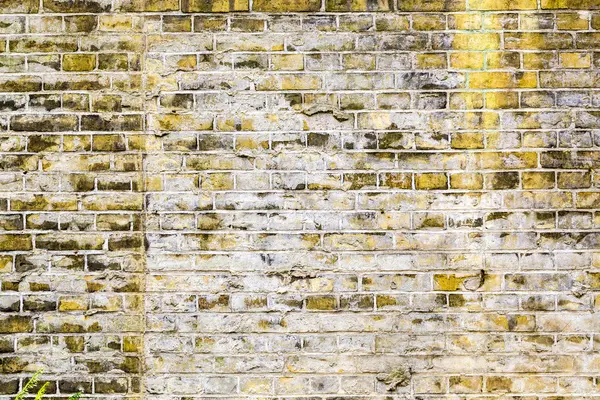 Alte grungy gelbe Ziegelwand für Hintergründe — Stockfoto