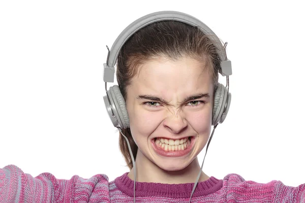 Enthusiastic teenage girl with headphones, isolated on white — Stock Photo, Image