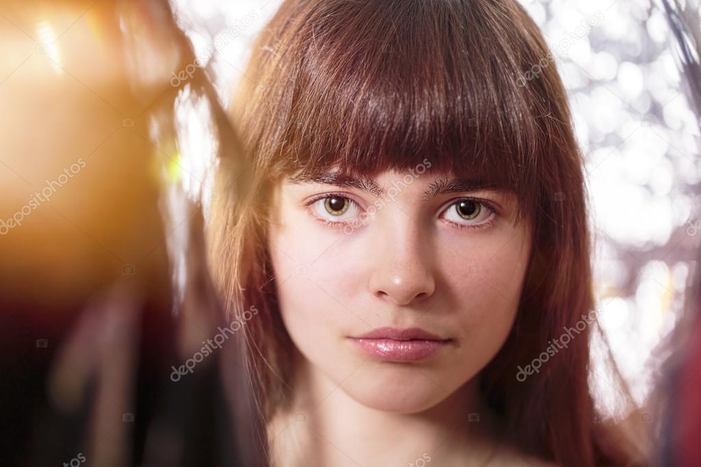portrait of a beautiful teenage girl, with light leak and bokeh