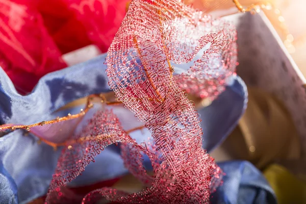 Chaotic pile of multi colored fabric gift ribbons — Stock Photo, Image