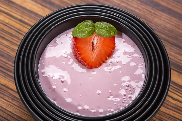 Quark with strawberry in a black asian bowl — Stock Photo, Image