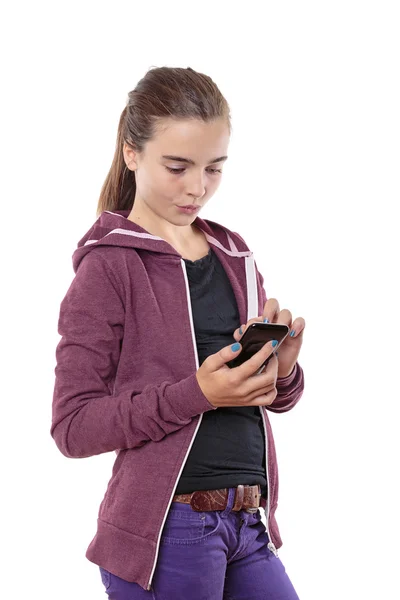 Mooie jonge vrouw met haar slimme telefoon, geïsoleerd op wit — Stockfoto