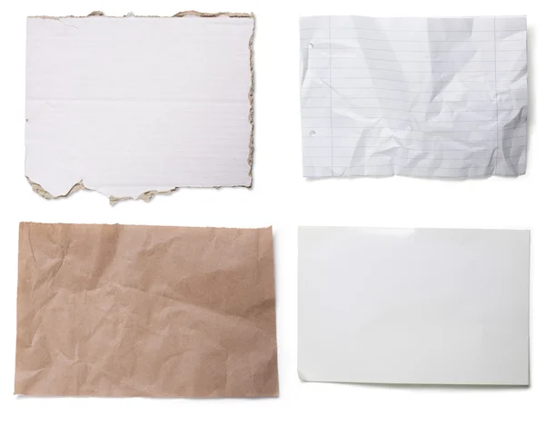 Cuatro diferentes piezas de cartón y papel, aisladas en blanco — Foto de Stock