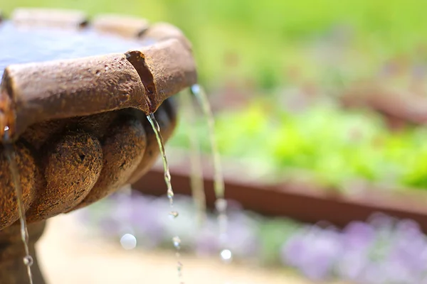 Close up of Stone Water Fountain in Flower Garden — Stock Photo, Image