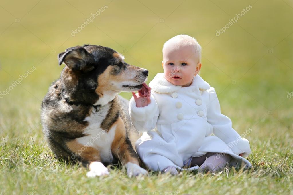 Precious year old Baby Girl Sitting Outside with Pet Dog — Stock