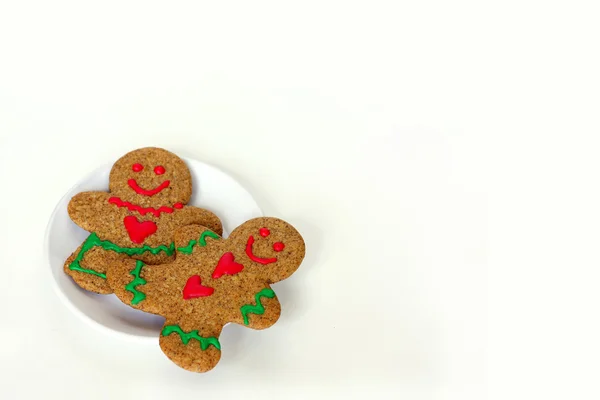 Christmas Gingerbread Man and Woman on Plate Isolated — Stock Photo, Image