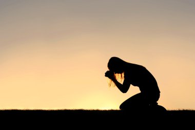 Christian Woman Sitting Down in Prayer Silhouette clipart