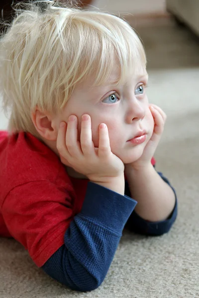 Adorable Young Child Laying on Living Room Floor — Stock Photo, Image