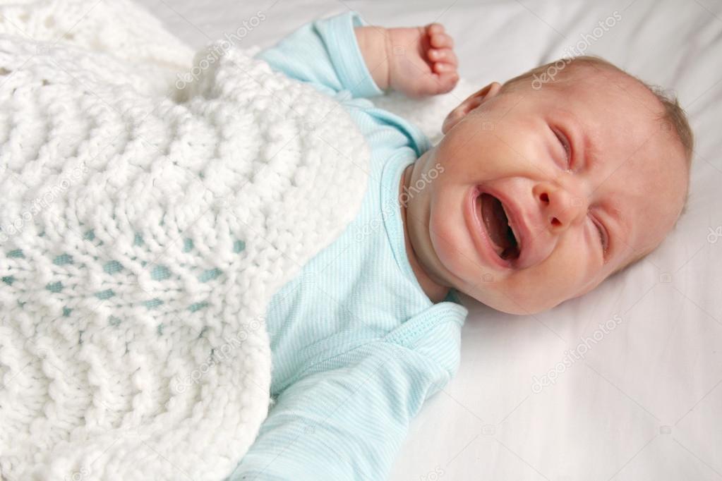 Sweet Newborn Baby Crying in Crib Stock Photo by ©Christin_Lola 70408923