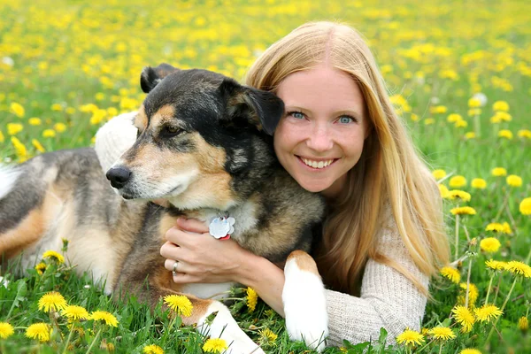 Happy Woman and Pet Dog Relaxing Outside Stock Picture