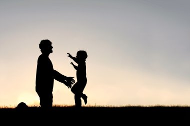 Happy Young Child Running to Greet Dad Silhouette clipart