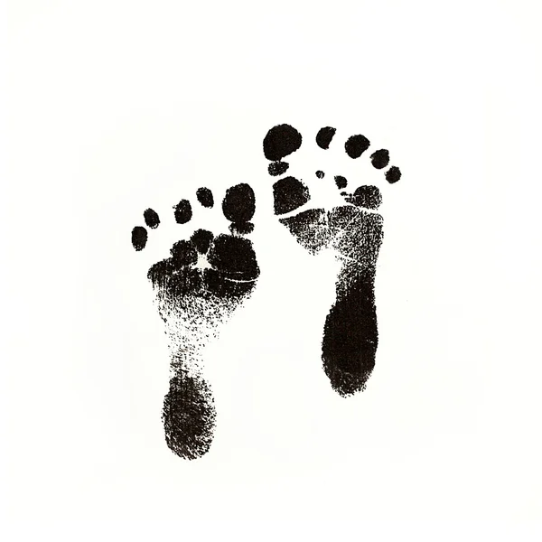 Empreintes pour bébé nouveau-né à l'encre noire — Photo