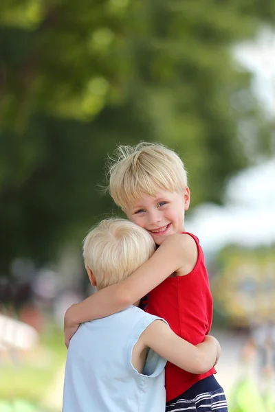 Happy Young Brothers Hug Outside — Stock Photo, Image