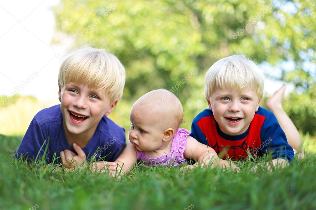 Three Happy Young Children Laughing Outside — Stock Photo © Christin ...