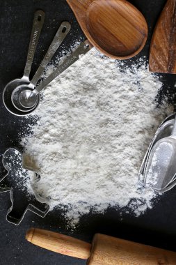 Vintage Baking Supplies Surrounding Pile of White Baking Flour