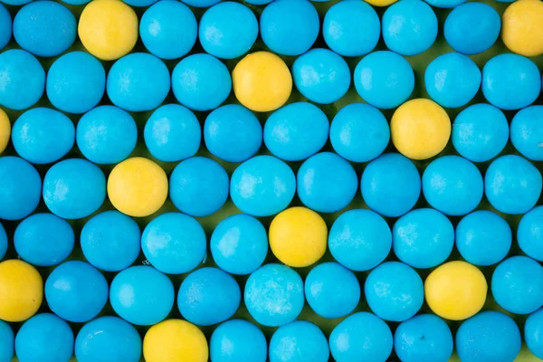 Fundo de caramelo azul e coberturas de chocolate — Fotografia de Stock