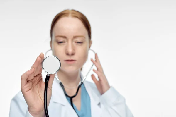 Young smiling female doctor with medical history — Stock Photo, Image