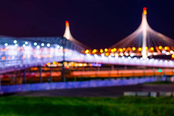 Pedestrian bridge with lanterns. Highlighting bridges. Panorama