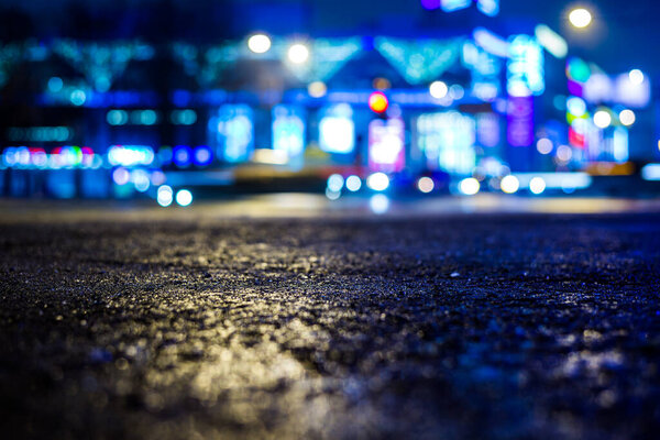 Rainy night in the big city, illumination lights of the shopping