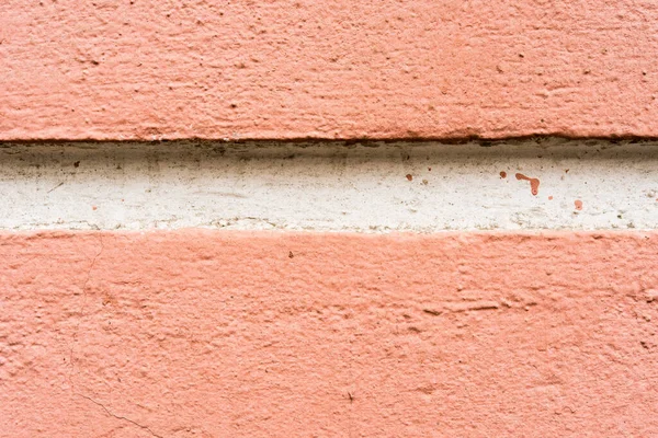 Wall with a white ledge. Close up view