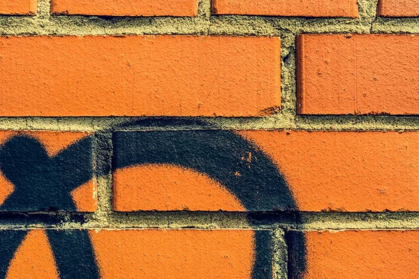 Graffiti Een Rode Bakstenen Muur Close Upzicht — Stockfoto