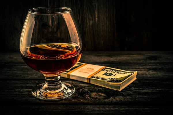 Glass Brandy Pack Dollars Old Wooden Table — Stok fotoğraf