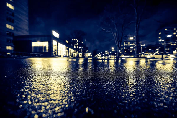 Rainy night in the big city, empty highway after the rain.