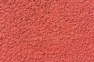 Küçük taşlı kırmızı beton duvar