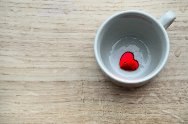 Cup with red heart — Stock Photo, Image