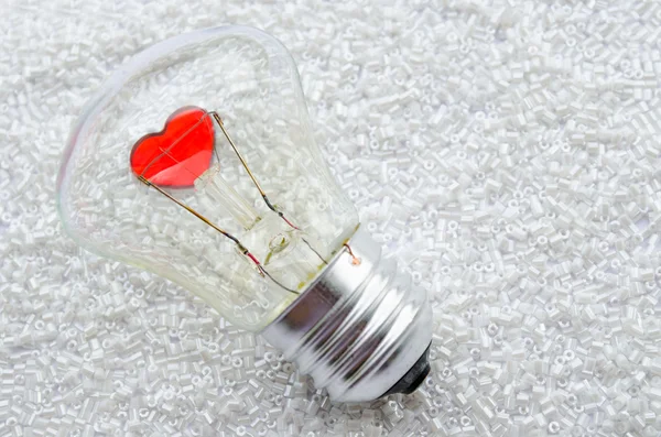 Red heart of an electric bulb — Stock Photo, Image