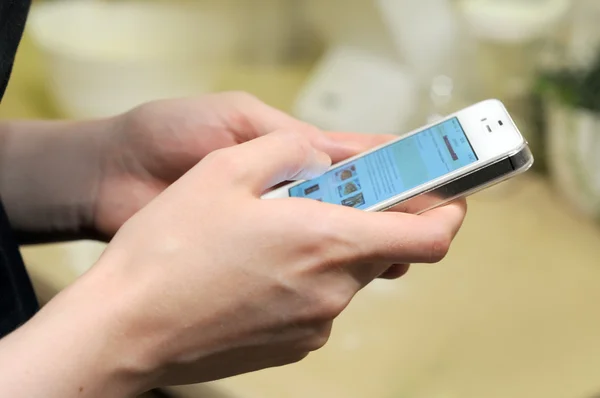 Man woman holds phone in hands and typing by fingers chatting — Stock Photo, Image