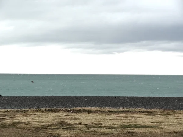 Sky, ocean, beach and land on Napier foreshore, New Zealand.