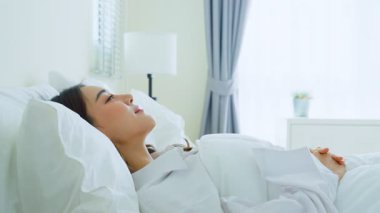 Woman resting comfortably in bright room