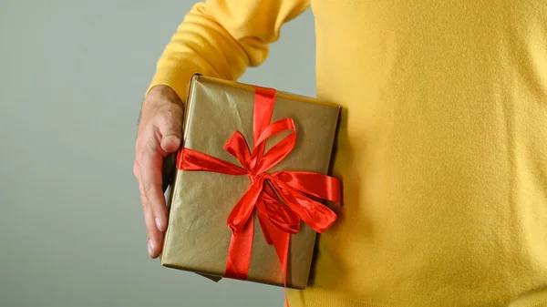 Man Holding Gift Box High Quality Photo Stock Image