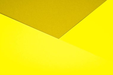Soyut kağıt geometrik arkaplan sarı tonlarda. 2021 yılının rengi aydınlatıcı. Yüksek kalite fotoğraf