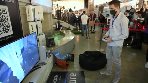 MINSK, BELARUS - MARCH 2, 2019: A man in a mask plays a Playstation 5 — Stock Video