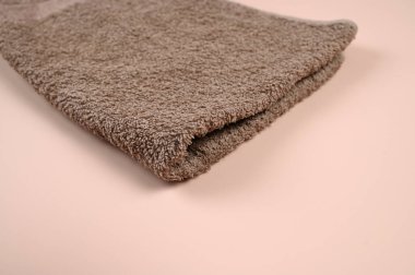 Kahverengi havlu yakın, düz yatıyordu. Yüksek kalite fotoğraf