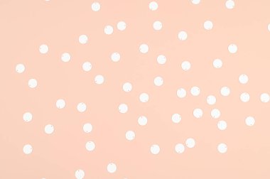 Bej bir arkaplanda sequins. Yüksek kalite fotoğraf