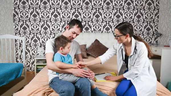 Father with a child and a doctor. High quality photo