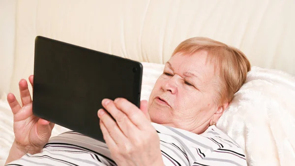 Elderly Woman Lies Bedroom Phone Her Hands — Stock Photo, Image