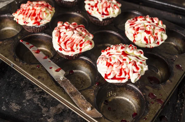 Chocolate pumpkin cupcake, decorated with icing Selective focus Stock Image