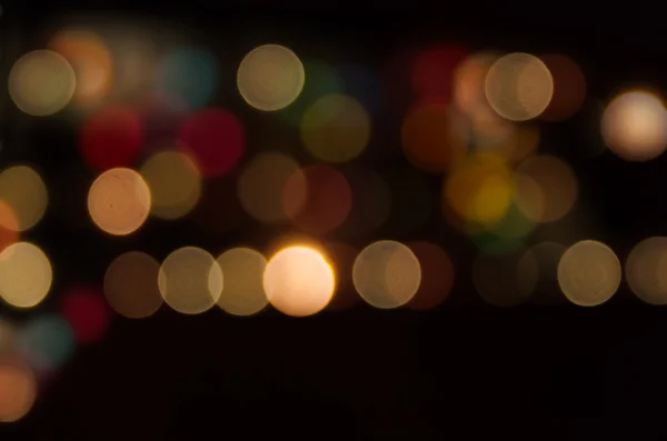 Éjszakai város utcai lámpák. Absztrakt kerek bokeh háttér — Stock Fotó